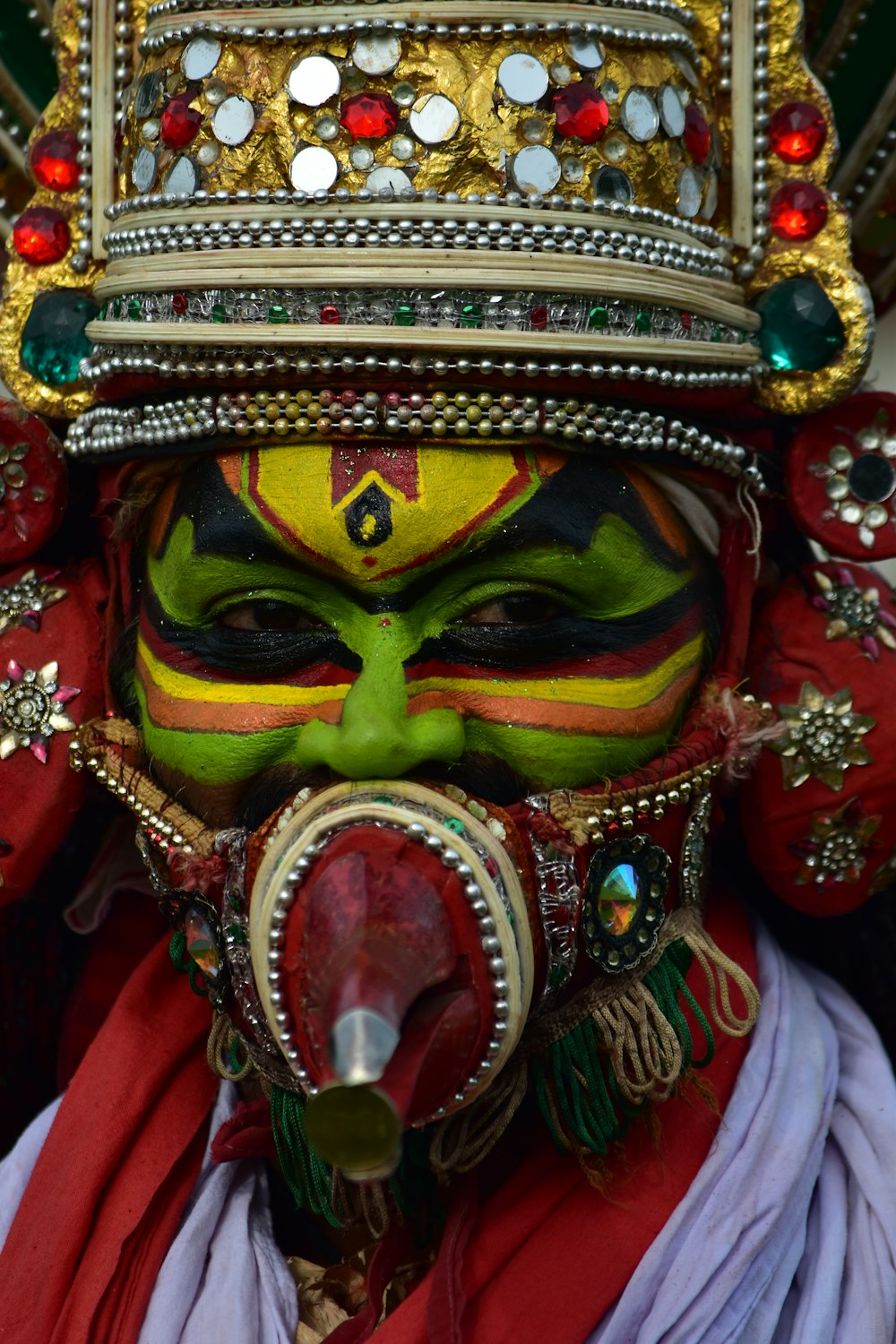 gold red and green mask