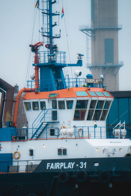 a large white and blue boat in the water