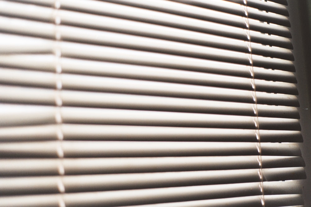 white window blinds during daytime