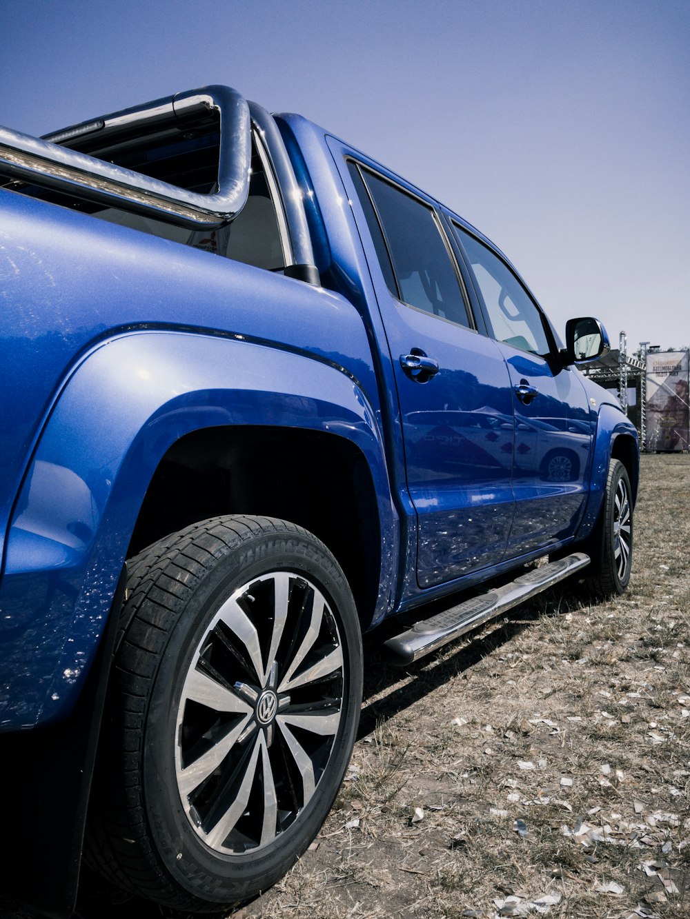 blue suv on gray dirt ground during daytime