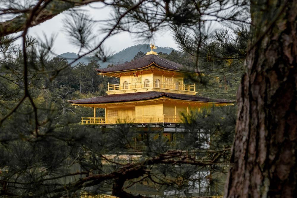 yellow and brown concrete building surrounded by trees