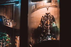 A beautifully embroidered traditional Moroccan caftan displayed on a mannequin in soft natural light.