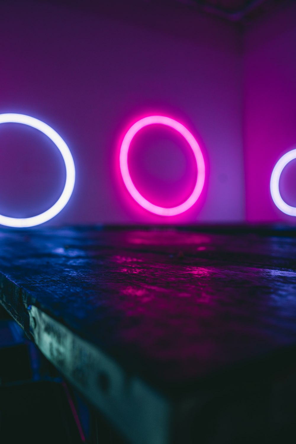 purple and white light on brown wooden table