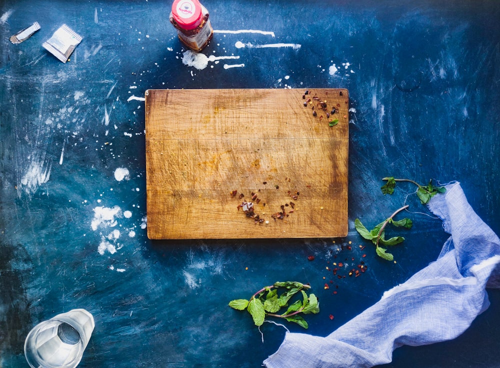 brown wooden board on blue water