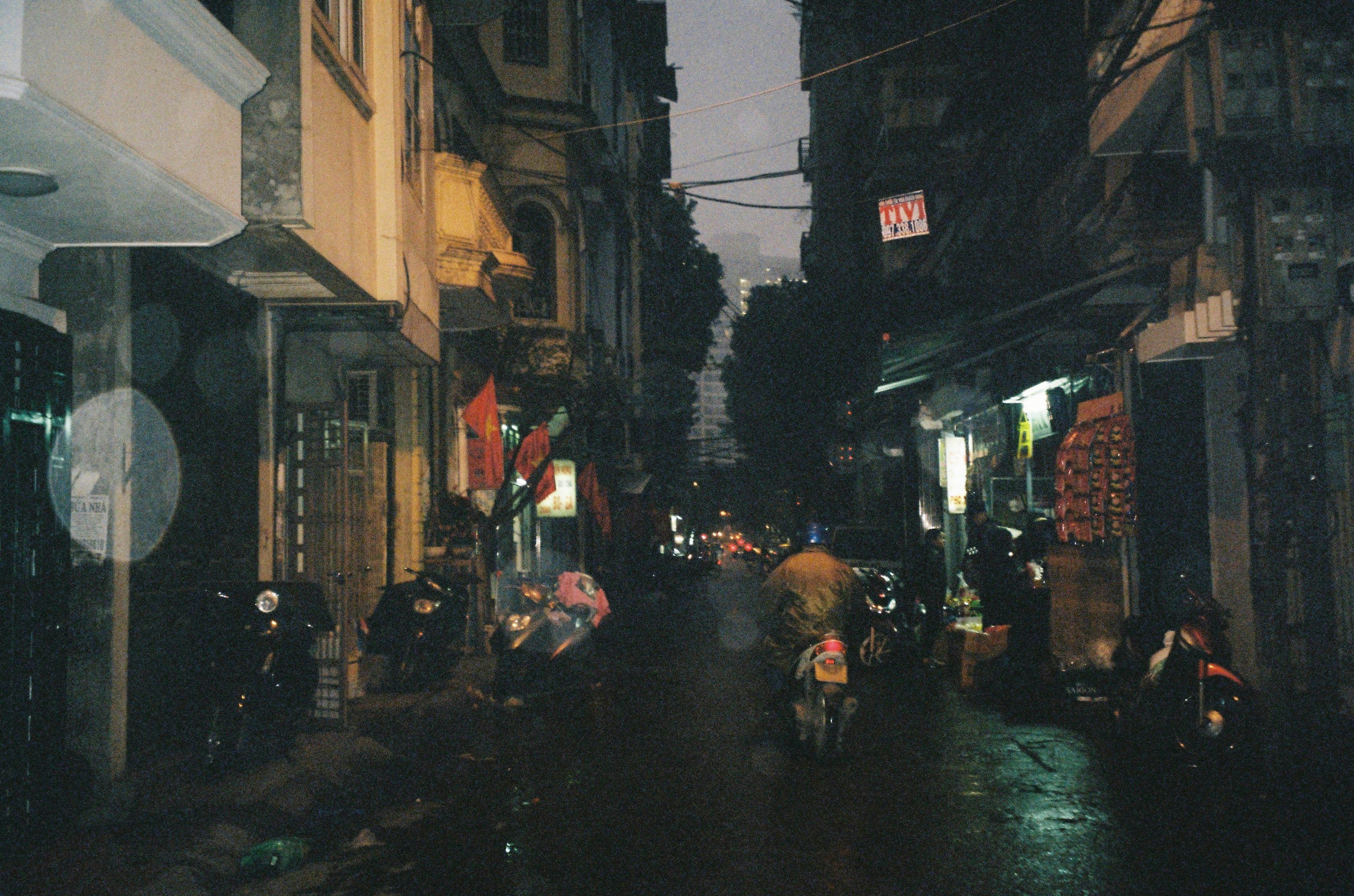 people walking on street during night time