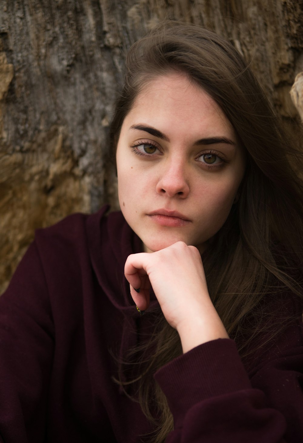 woman in maroon long sleeve shirt