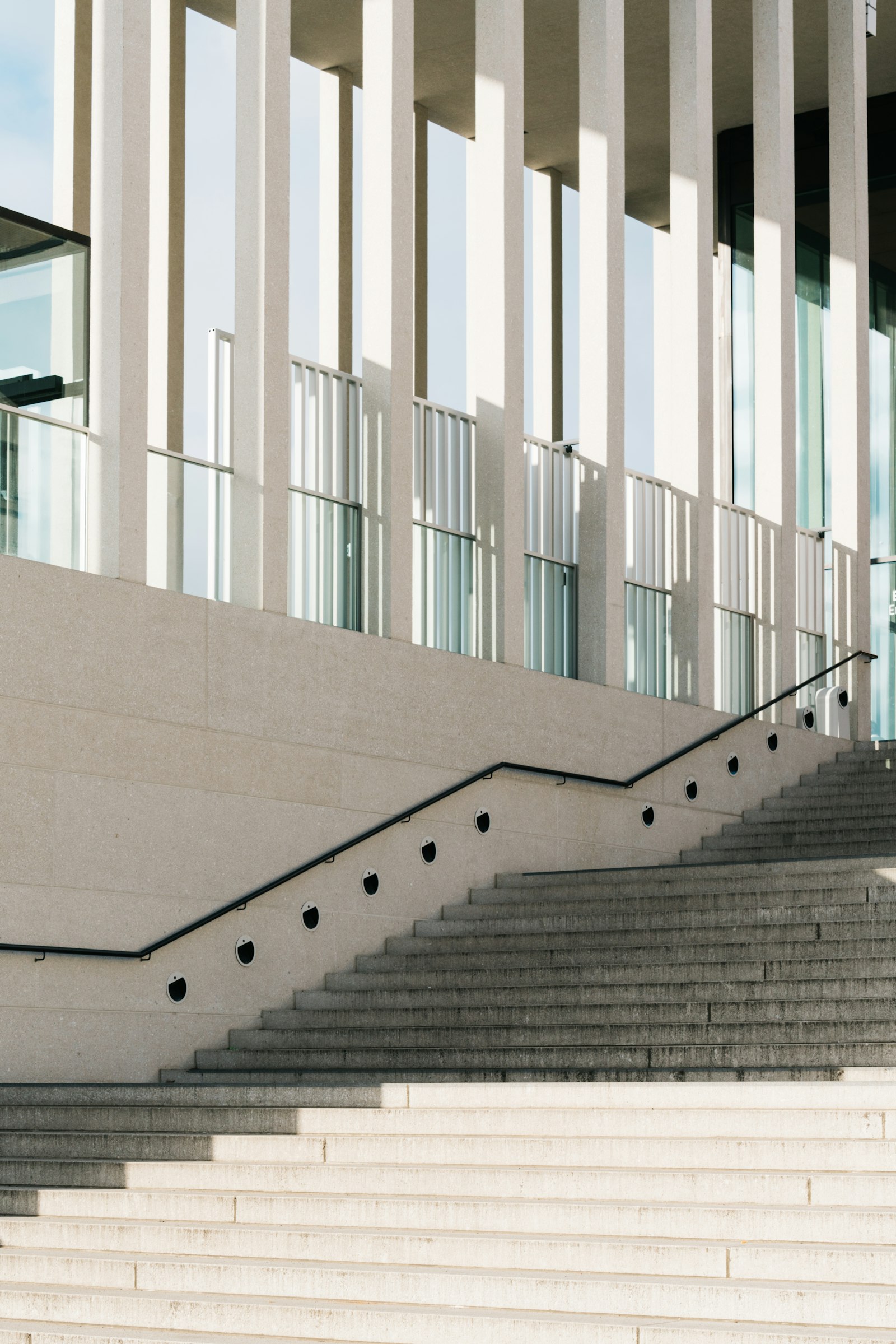 Sony a7R II + Sony FE 70-200mm F2.8 GM OSS sample photo. White concrete staircase with photography