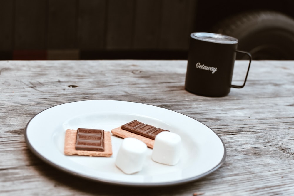 white ceramic plate with biscuits