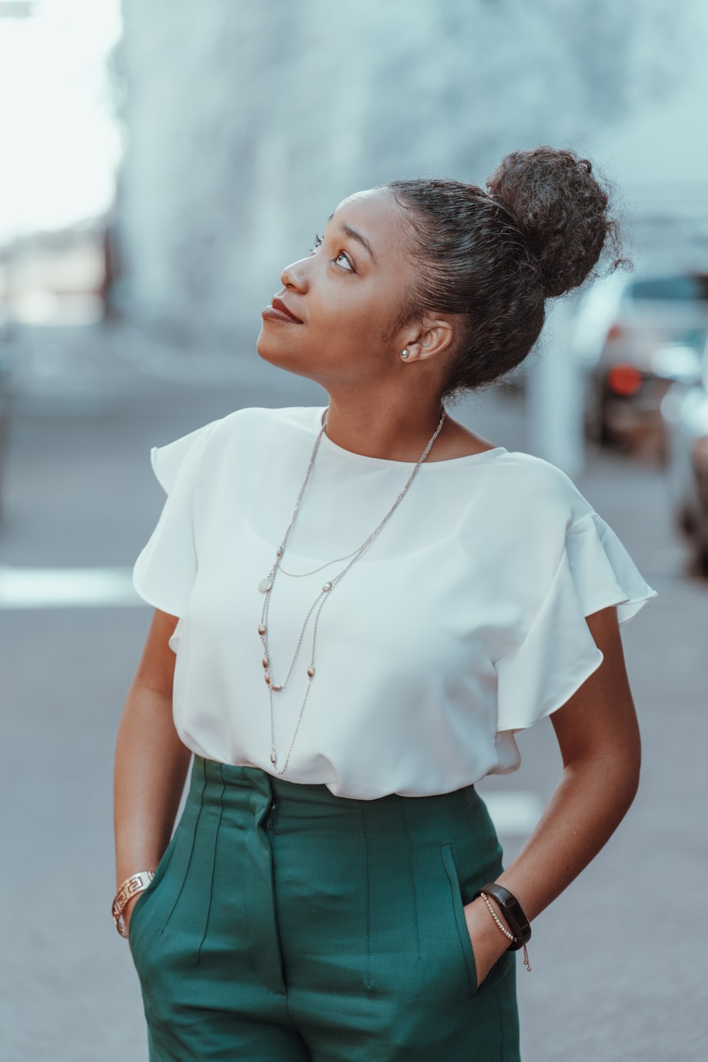 woman in white crew neck t-shirt and green denim shorts