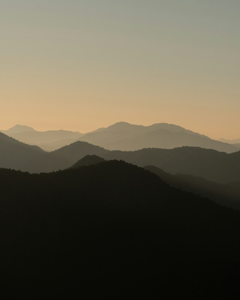 silhouette of mountains during daytime