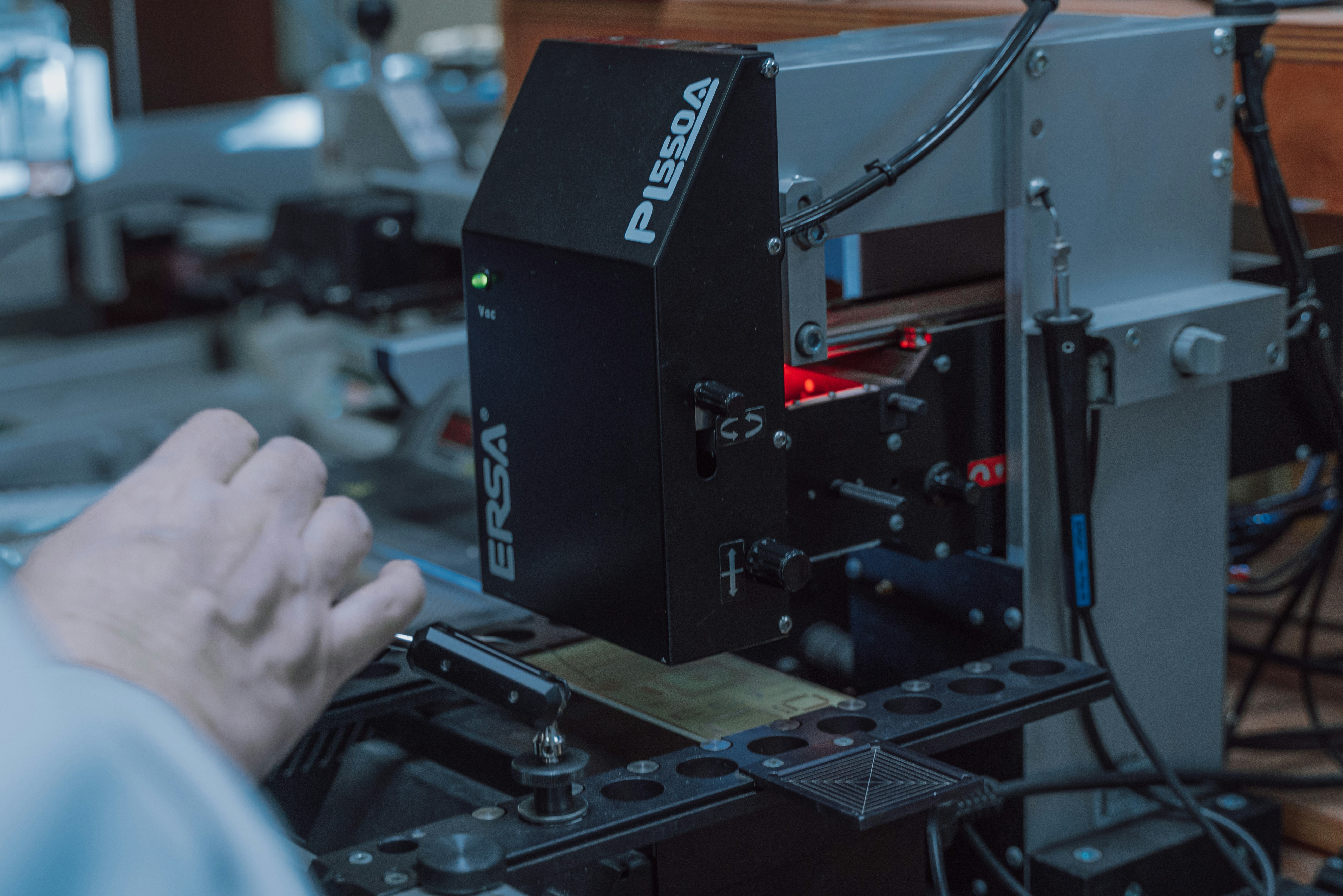 person holding black and gray audio mixer