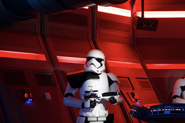 An intense sci-fi battle scene featuring futuristic soldiers and glowing energy weapons on a distant planet.