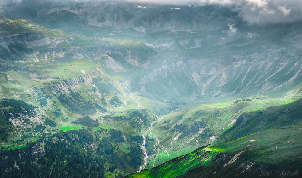 green and gray mountains under white sky during daytime