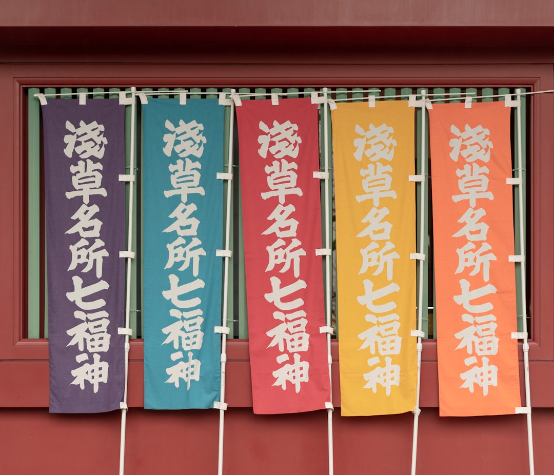 red and white kanji text wall decor