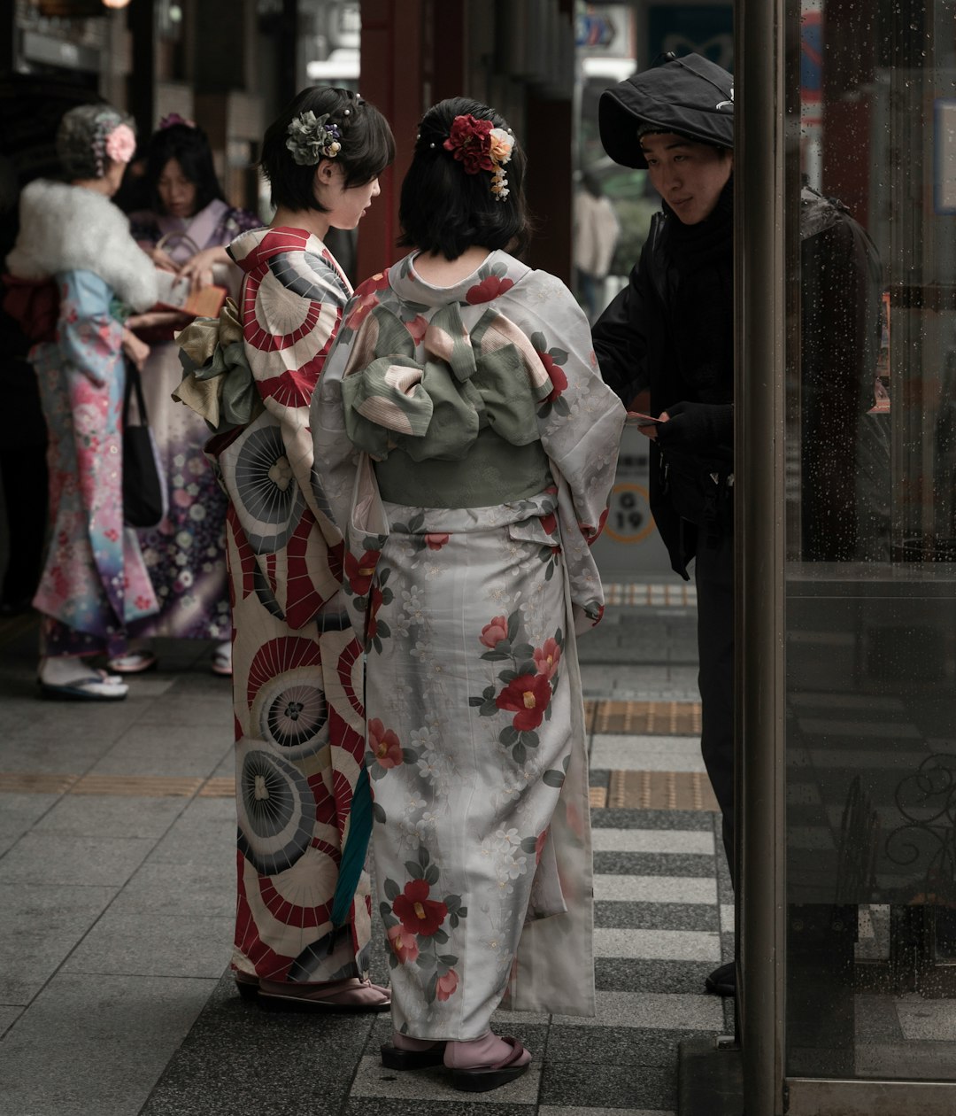 people in white and red kimono standing on gray concrete floor during daytime