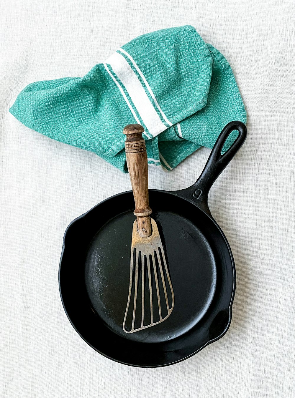 brown handle fork on black round plate