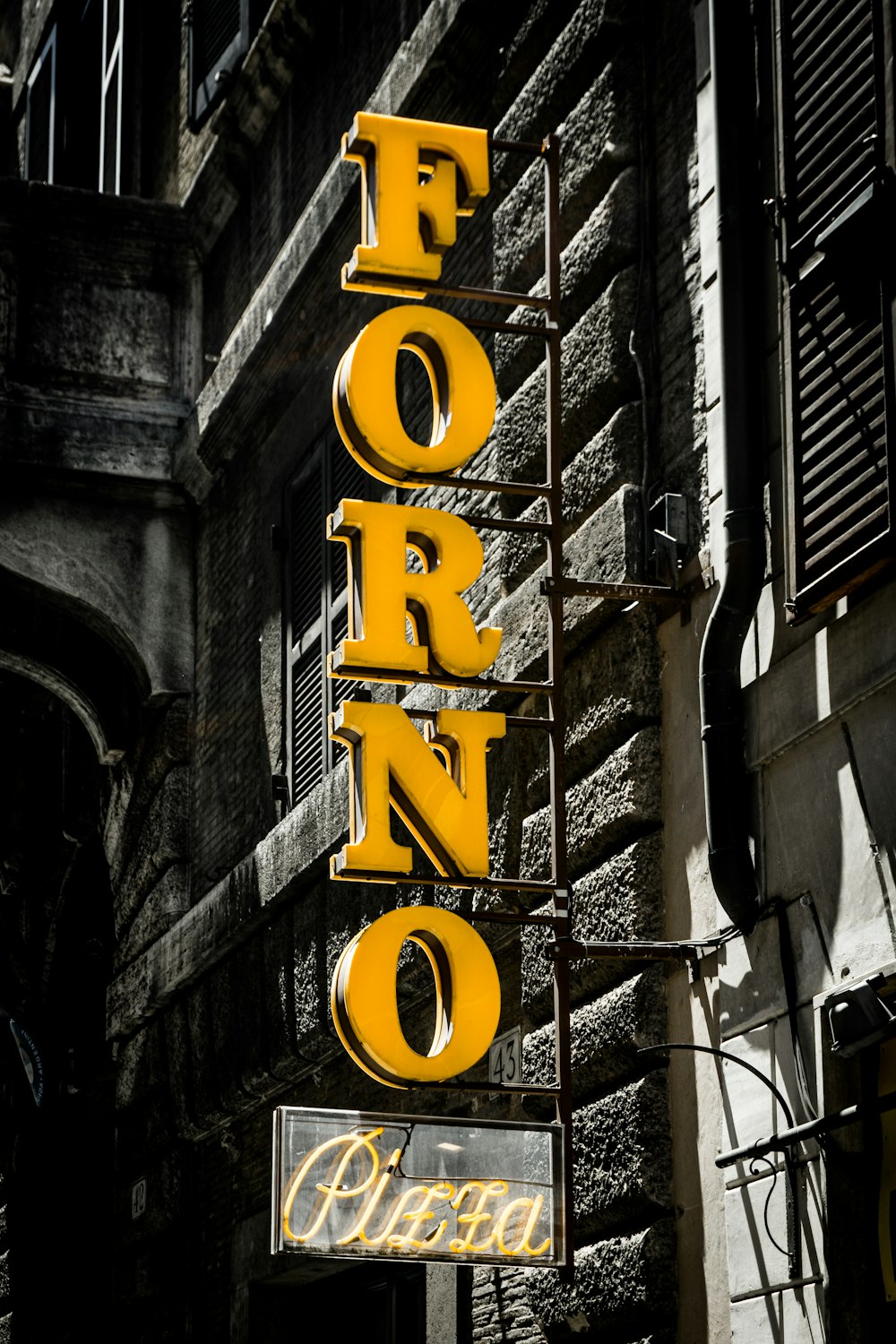 yellow and black love neon light signage