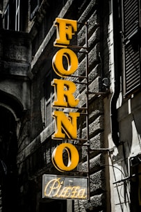 yellow and black love neon light signage