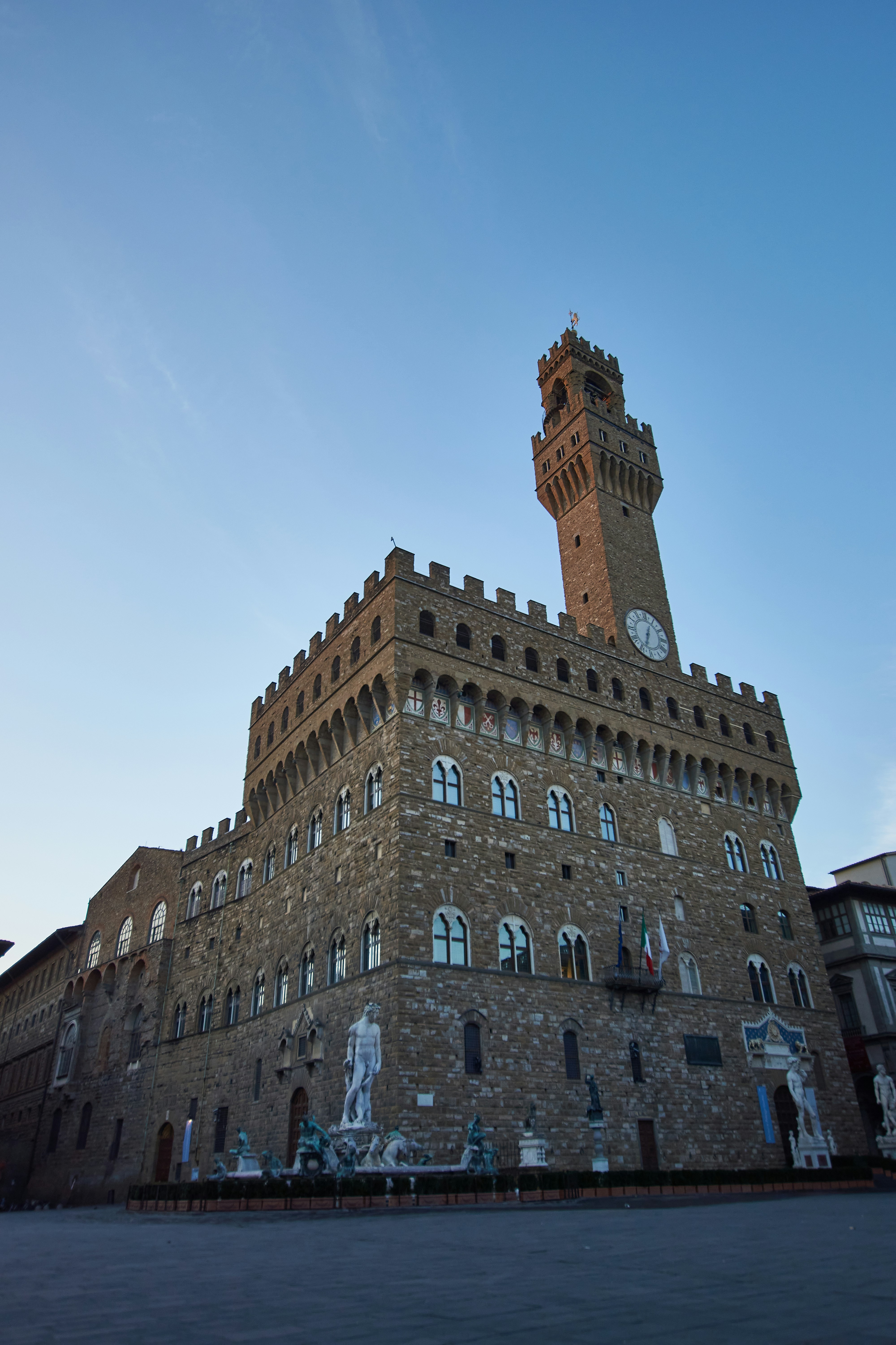 brown concrete building under blue sky during daytime