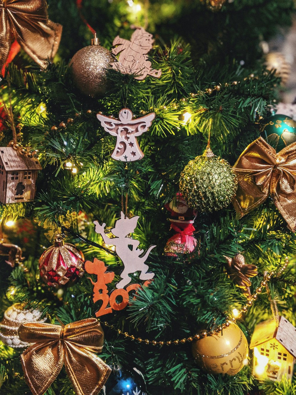 green and red christmas baubles on green christmas tree