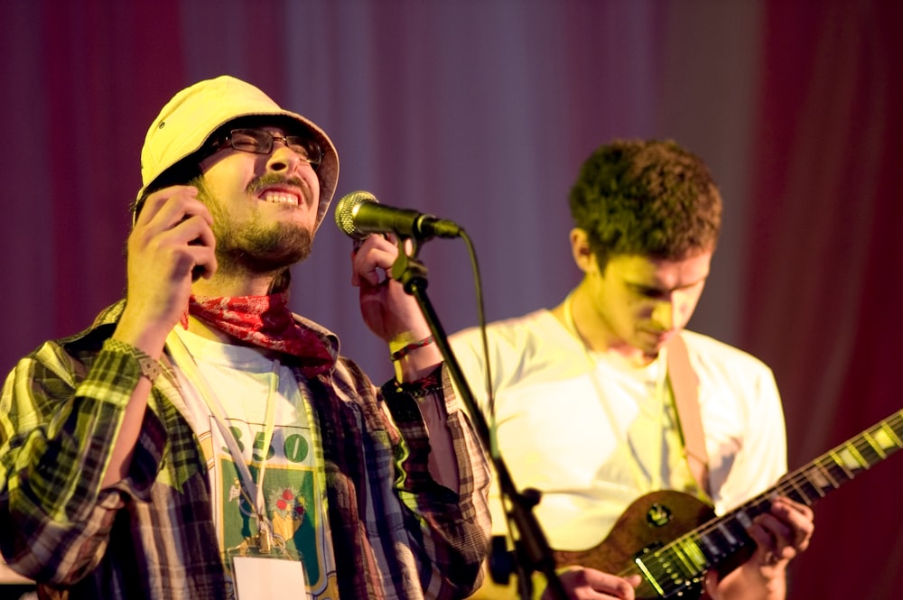 man in yellow hat singing