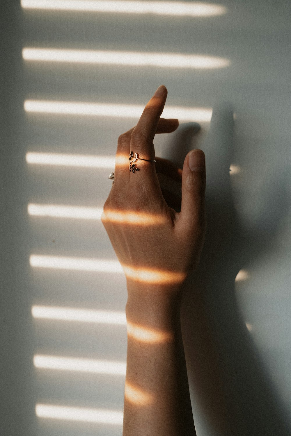 person wearing gold diamond ring