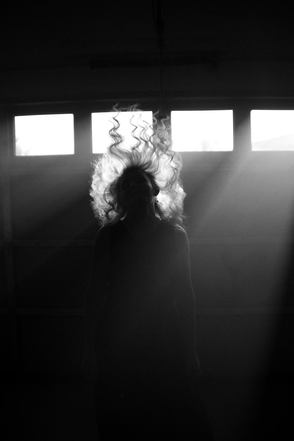 grayscale photo of woman in black dress