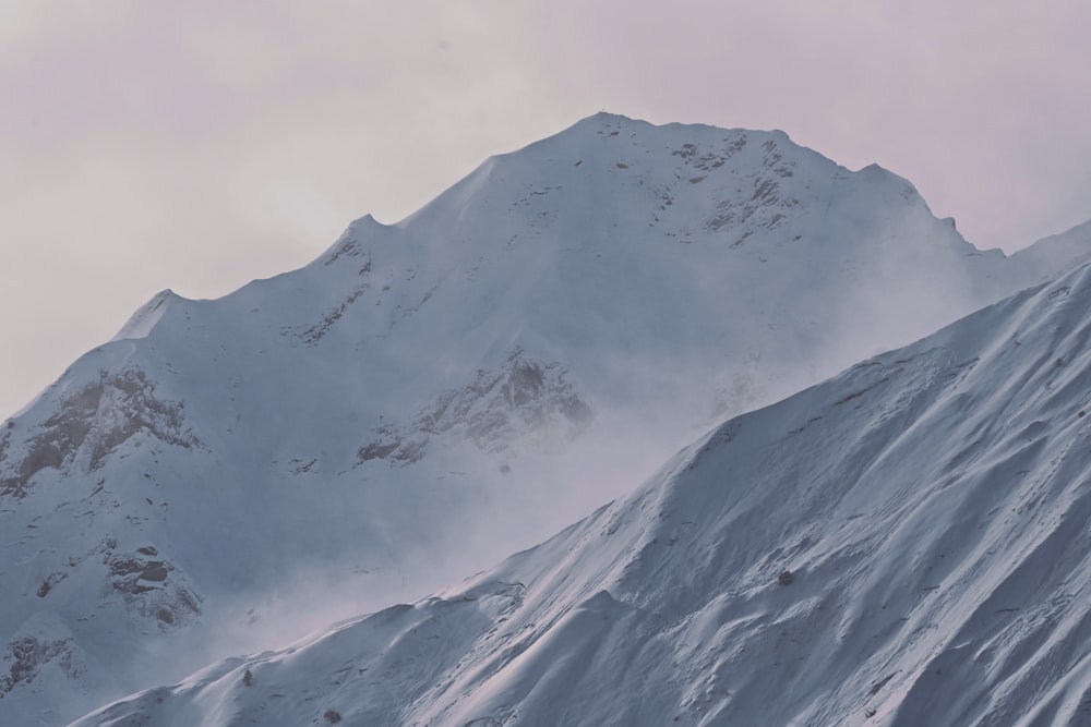 snow covered mountain during daytime