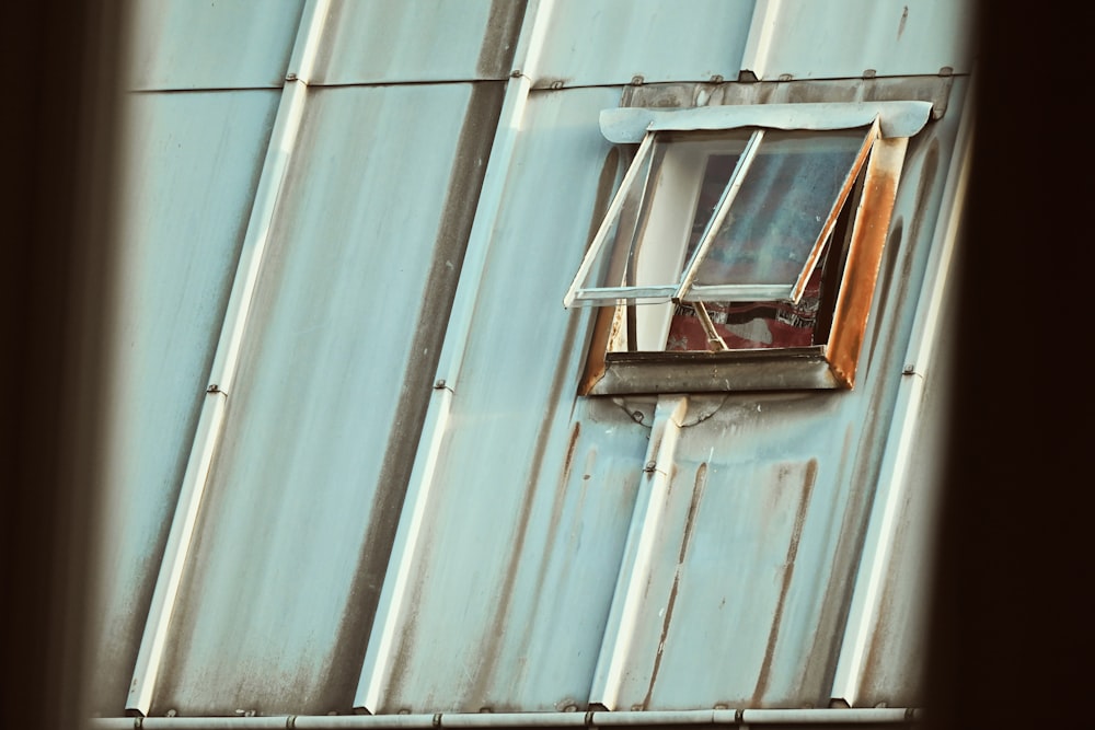 brown wooden window frame on white wall