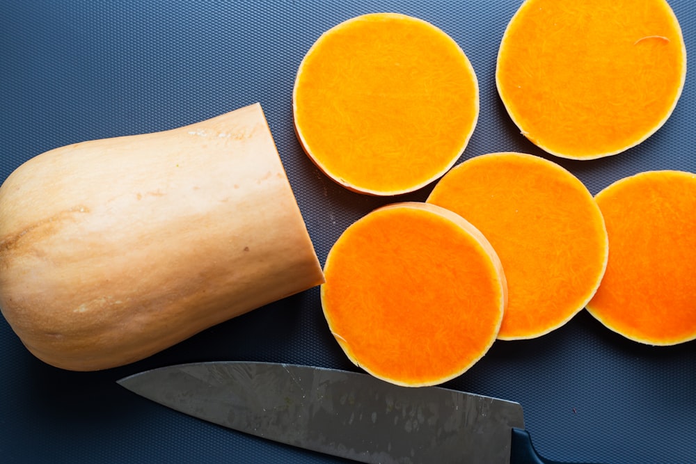 sliced orange fruit on white tissue paper