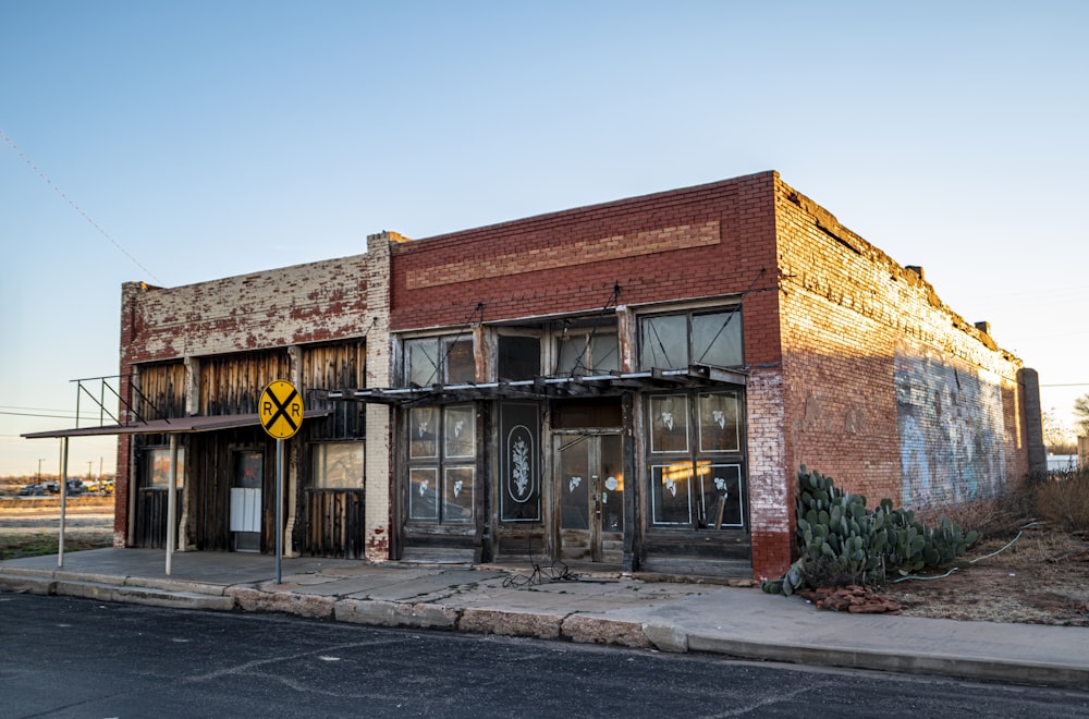 brown brick building with black wooden door