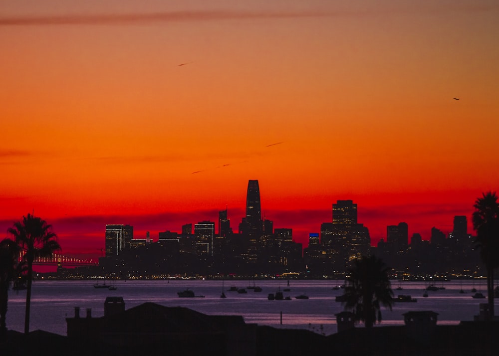 city skyline during orange sunset