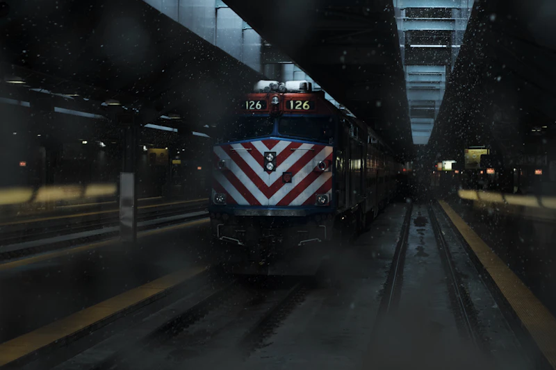 A Metra commuter train arriving at Ogilvie Transportation Center during a snowstorm