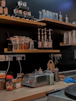 Bright, tidy break room with spotless countertops and organized shelves.
