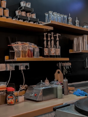 Bright, tidy break room with spotless countertops and organized shelves.