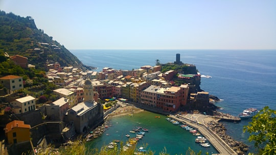 aerial view of city buildings near body of water during daytime in Parco Nazionale delle Cinque Terre Italy
