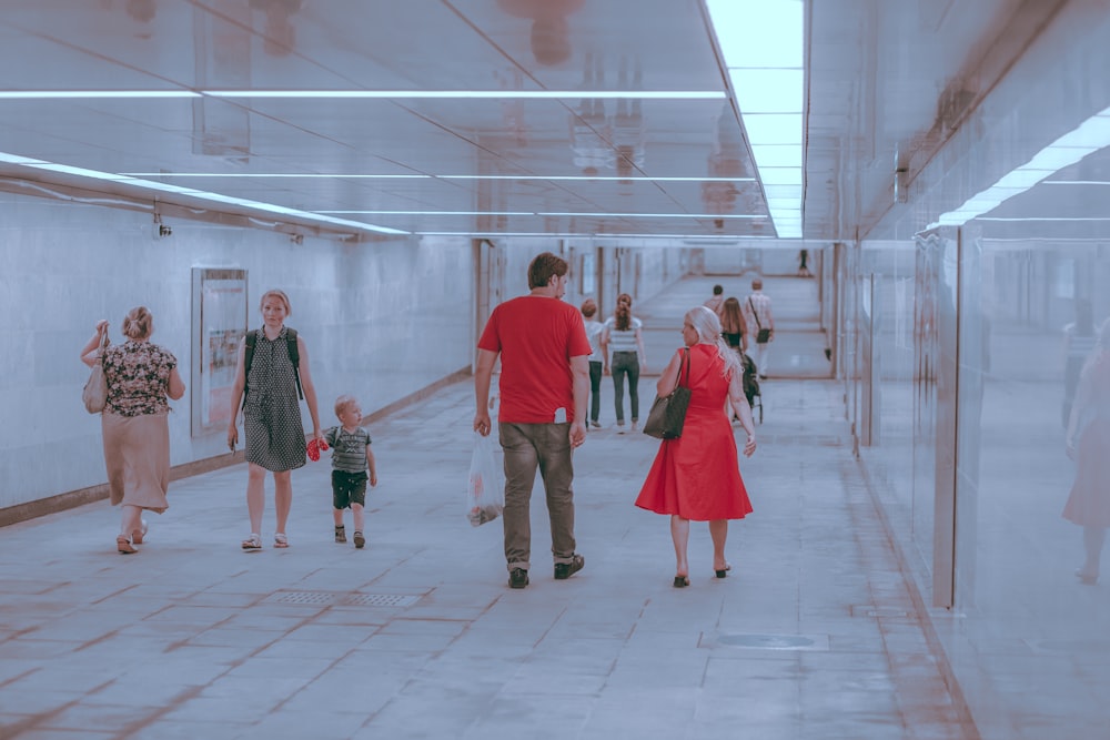 people walking on white tiled floor