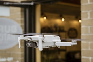 white drone on white metal rack