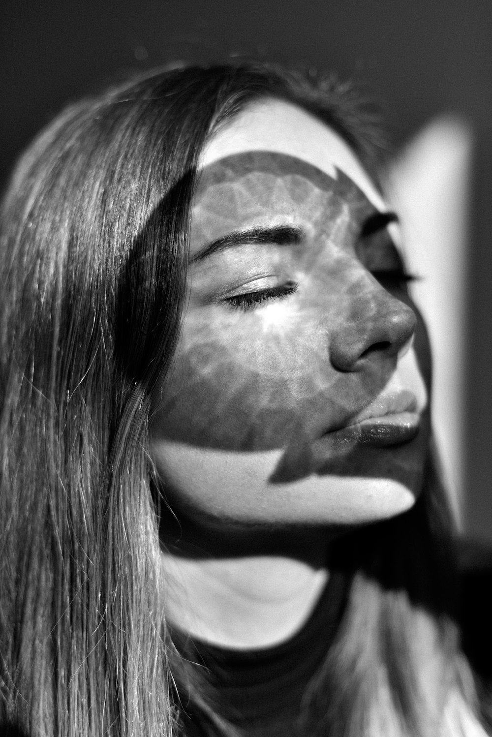 grayscale photo of woman with white and black face mask