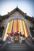 The temple's intricately carved main entrance adorned with marigold garlands.