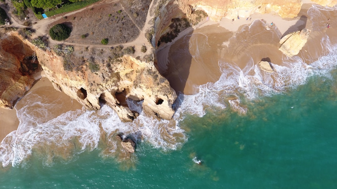 an aerial view of a beach and cliffs