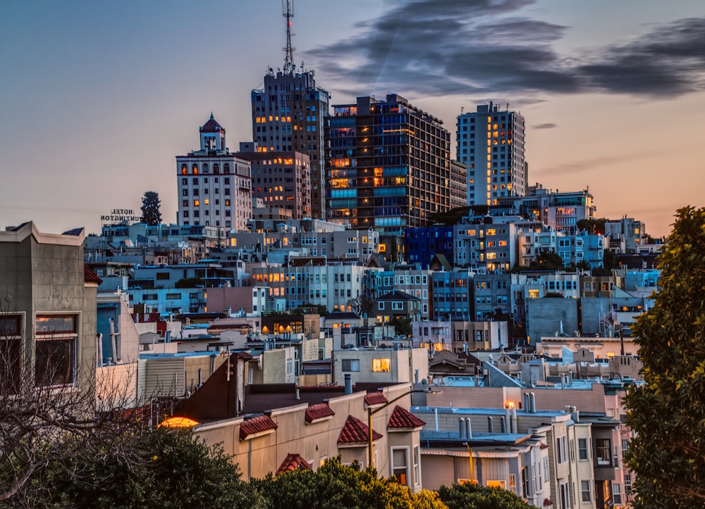 city buildings under cloudy sky during daytime