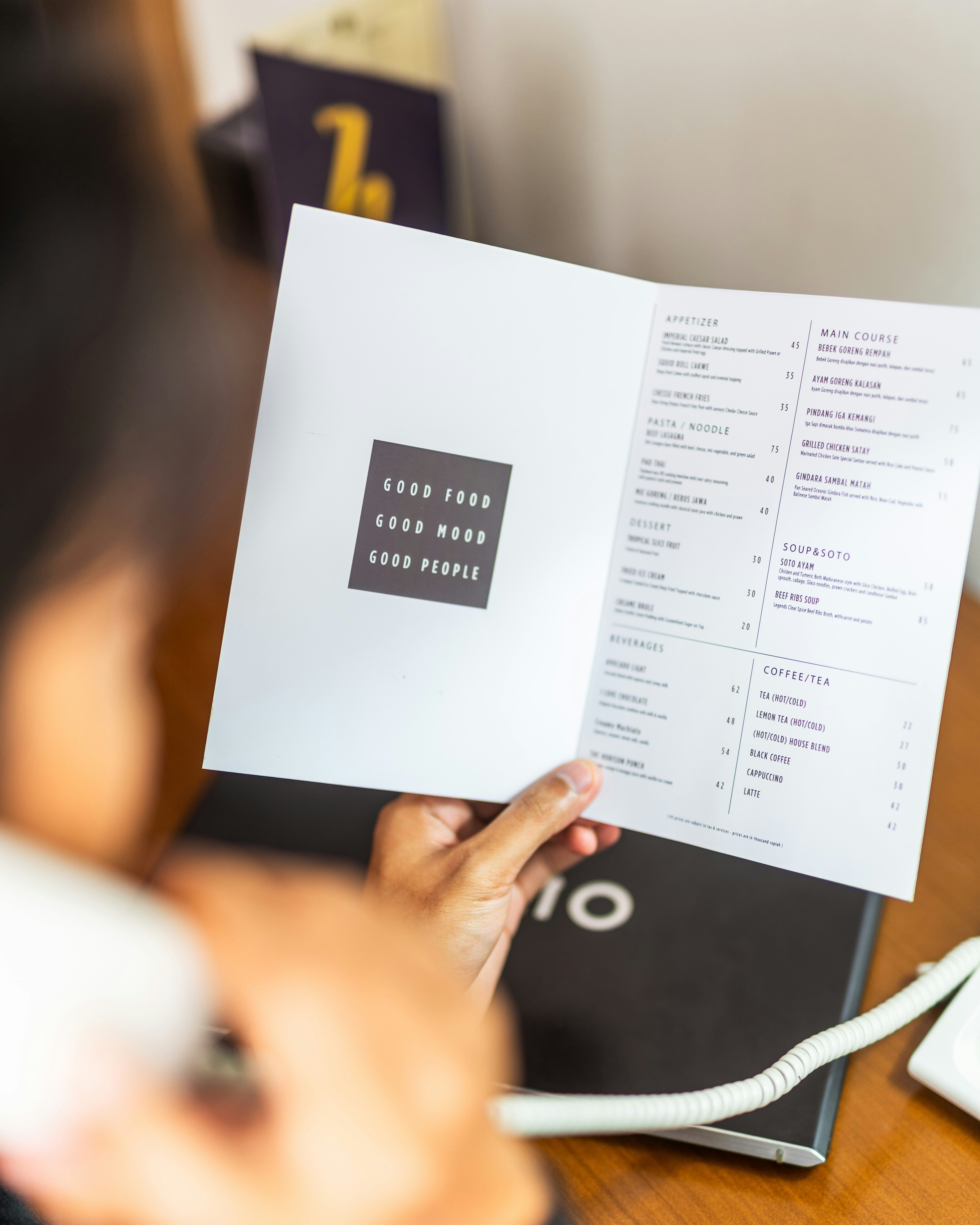 person holding white printer paper