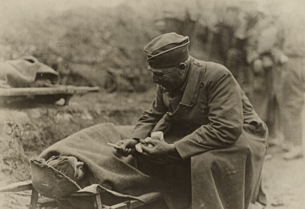 soldier offering a fellow soldier a cigarette