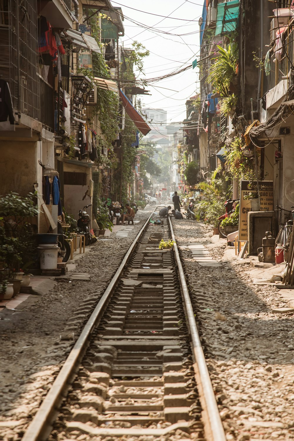 train rail between houses during daytime