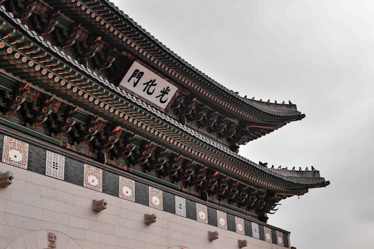 brown and white concrete building in Gwanghwamun Gate South Korea