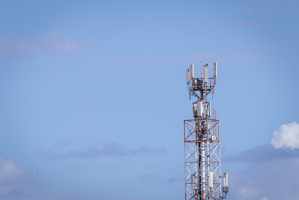 white and black metal tower under white sky during daytime