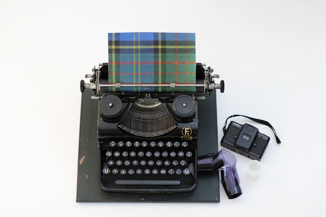 black and green typewriter beside purple and white plastic bottle, Scottish Literature