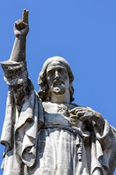 gray concrete statue under blue sky during daytime
