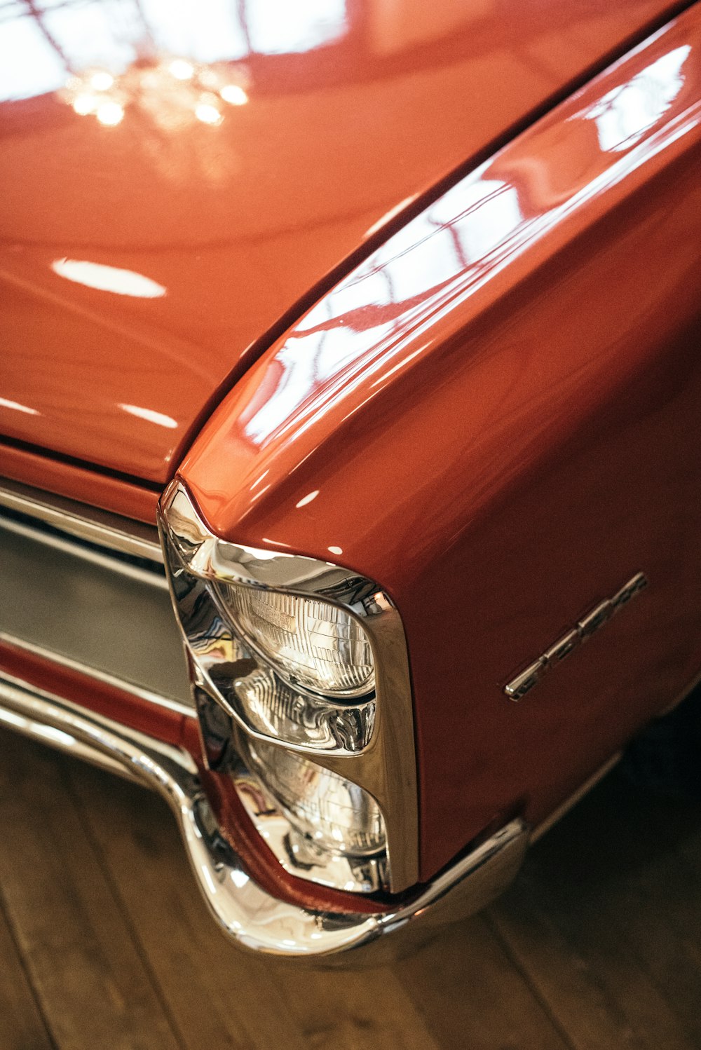 orange car with chrome engine